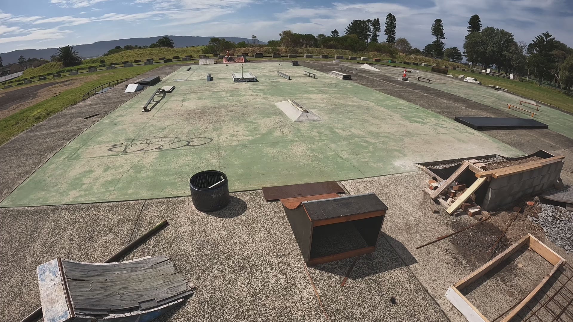 Load video: video of a radio controlled car doing stunts at a skateboarding park.